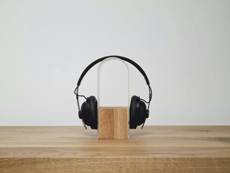 Studio headphones on a wooden stand